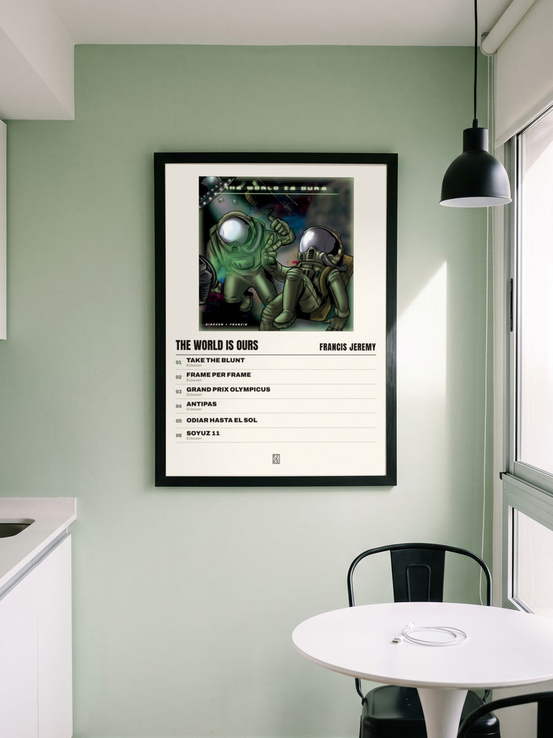 Póster de The World Is Ours de Francis Jeremy enmarcado en una pared, en un ambiente real