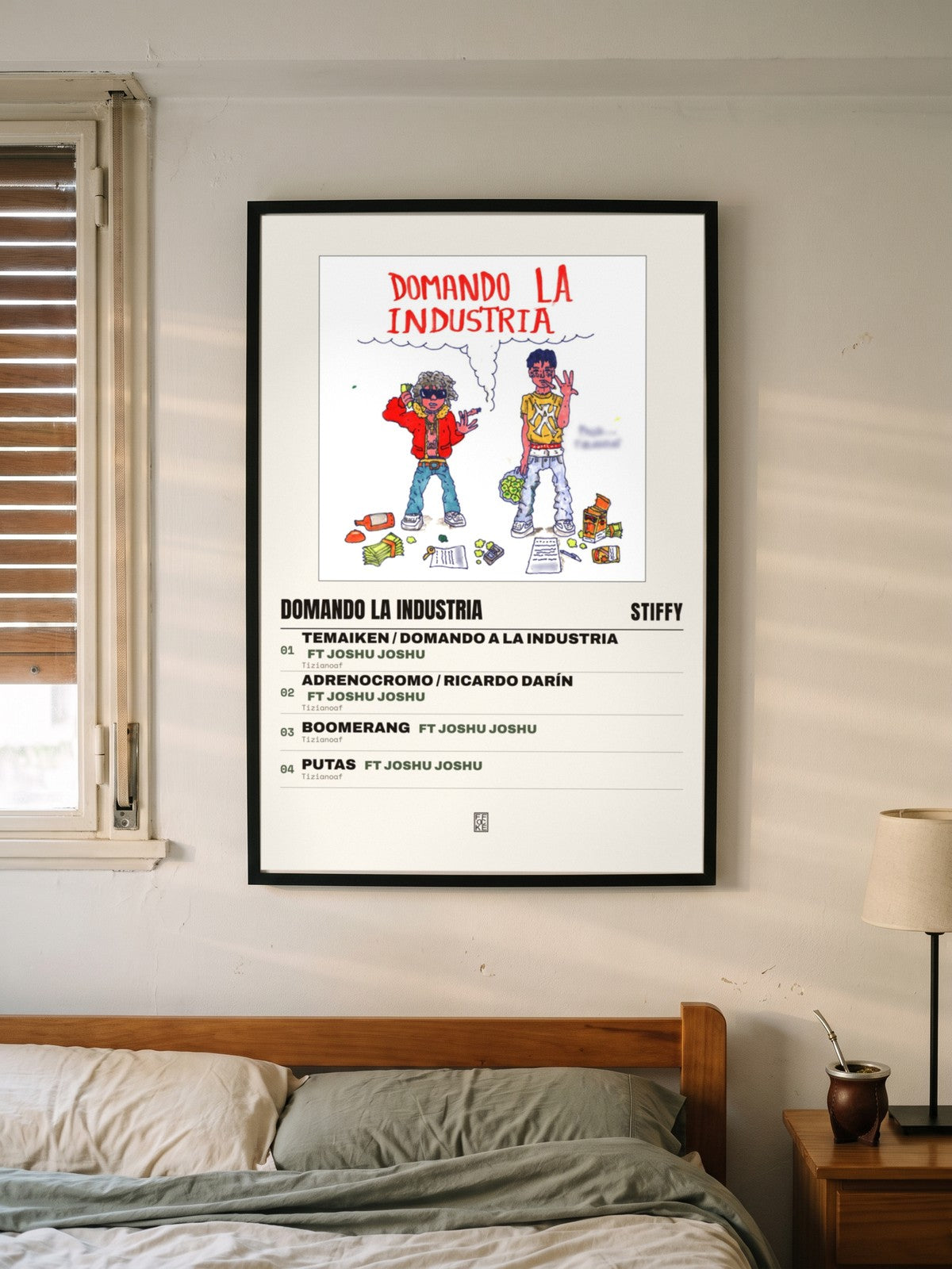Póster de Domando la Industria de Stiffy enmarcado en una pared