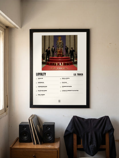 Póster de Loyalty de Lil Troca enmarcado en una pared