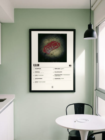 Póster de C.D.M de Rei enmarcado en una pared